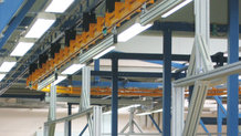 Power& Free System to move mounting trolleys for cable harnesses, automatically